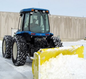 Image of a large tractor plowing snow